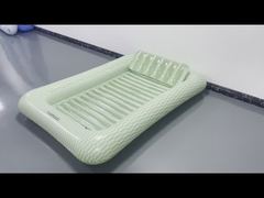 Inflatable floating bed